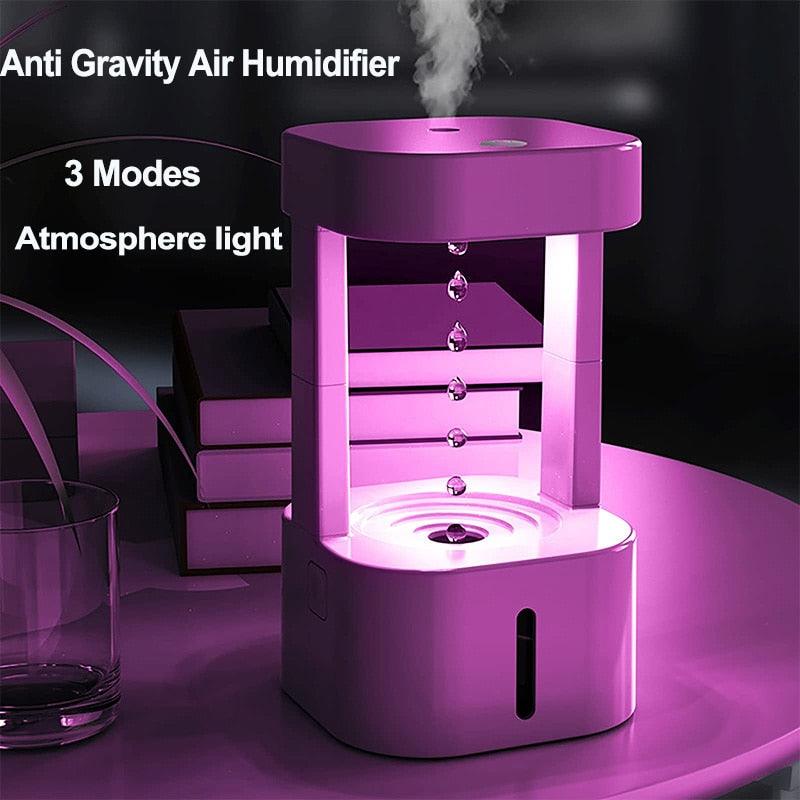 A picture of the humidifier dropping water and a violet light anti gravity humidifier